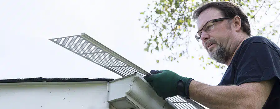 Handyman Installing Gutter Guards